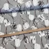 Szürkés alapon szürke-fehér tulipános dekortextil