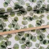 Világos alapon zöld leveles dekortextil
