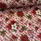 Kockás alapon mikulásvirágos csokros-díszes karácsonyi dekortextil (TH)