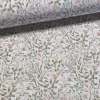0.16 m EGYBEN KÉRHETŐ Fehér alapon tavaszi leveles-indás (zöld-barackos) dekortextil (digitálisan nyomott)