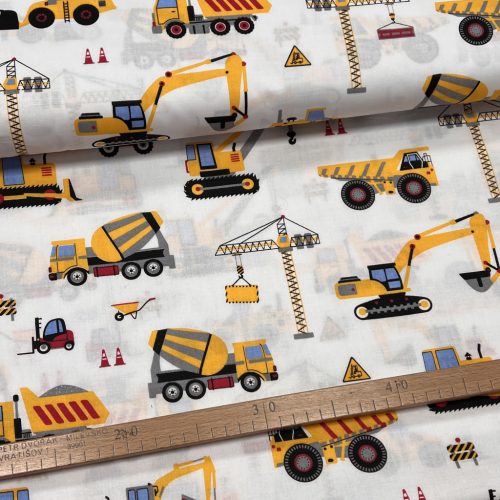 Fehér alapon sárga munkagépes 160 cm sz. pamutvászon