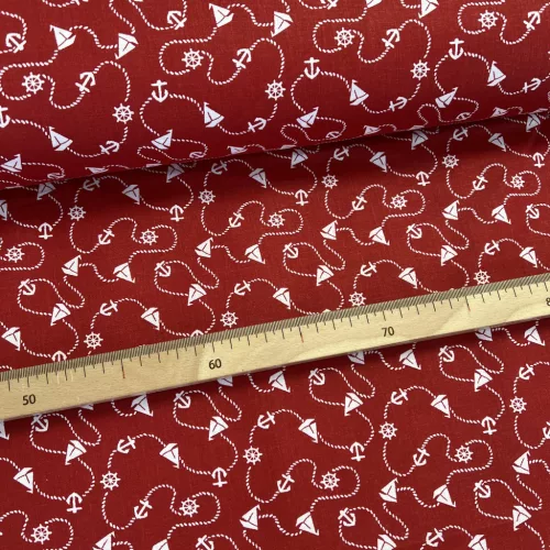 Piros alapon kishajós-kormánykerekes pamutvászon