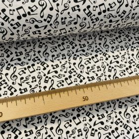 Fehér alapon kis fekete hangjegyes pamutvászon
